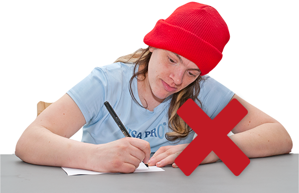 Person writing with a red cross.